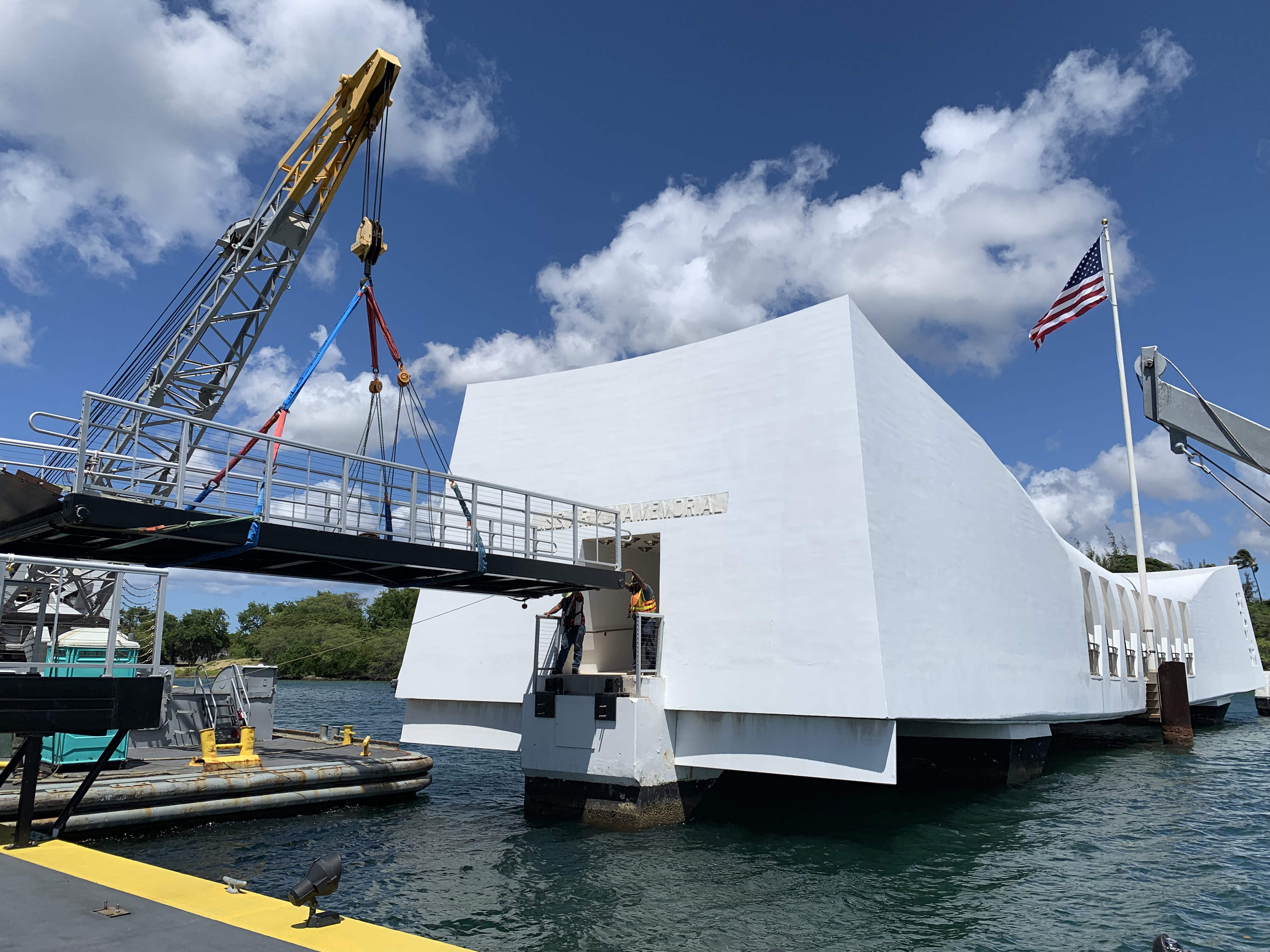 Photo of crane setting a bridge at the USS Arizona Memorial in Pearl Harbor, Hawaii